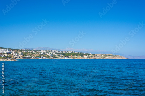 view from the sea to the Mediterranean city on the shore and the mountains. Greece, Crete, Rethymno. © pal1983