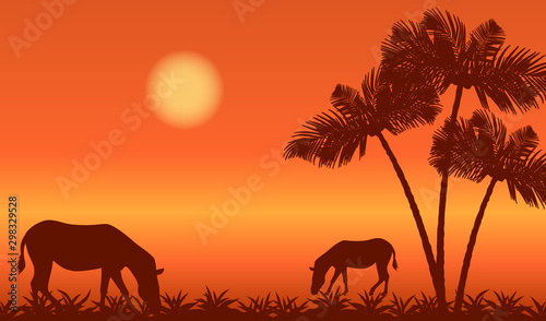 Africa landscape with zebras silhouettes and palm trees