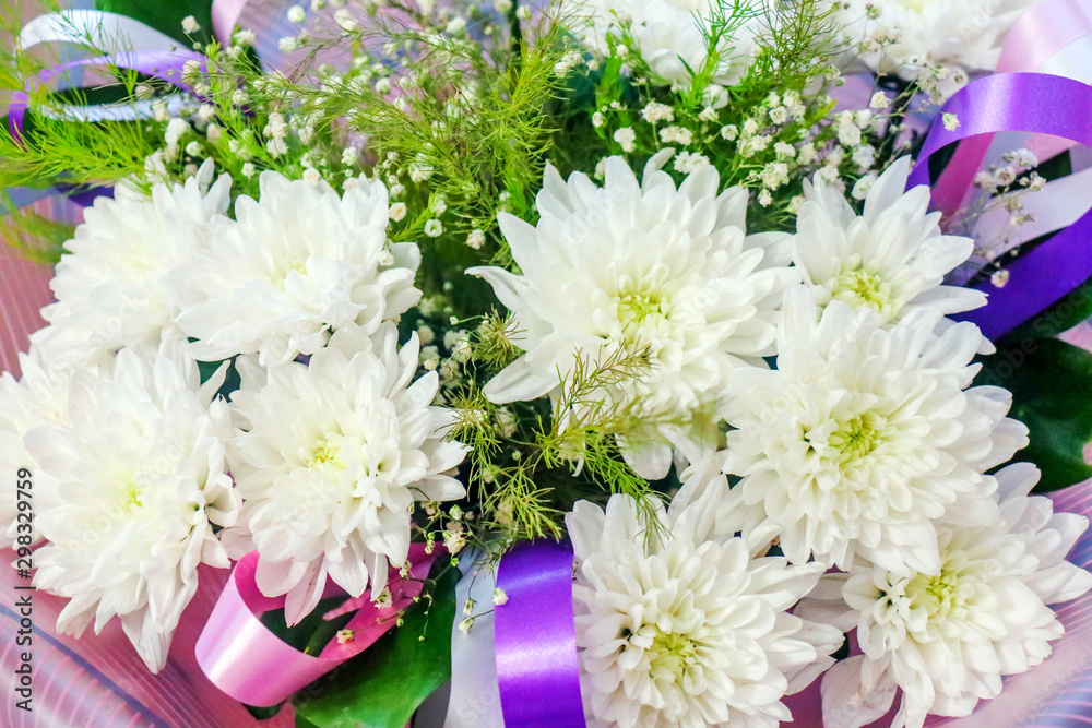festive bouquet of white chrysanthemums with ribbons