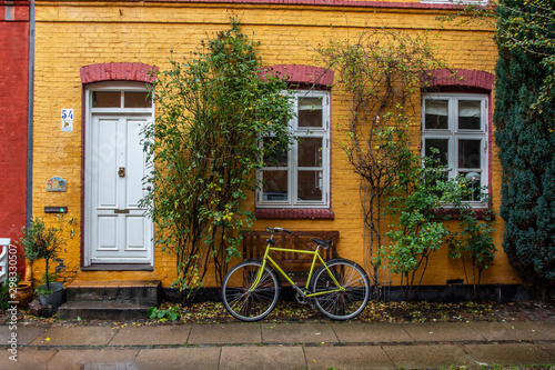yellow bicycle and old house