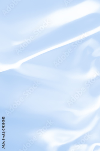 . Blue liquid shiny background. © Miodrag