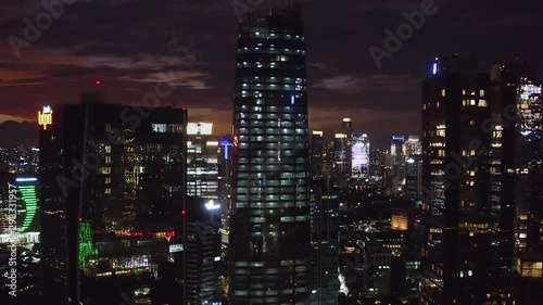 Wallpaper Mural JAKARTA, Indonesia - October 22, 2019: Exotic aerial view of night lights glowing on the silhouette of skyscrapers in business district. Shot in 4k resolution from a drone flying forwards Torontodigital.ca