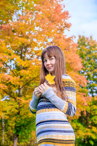 Girl on a walk in the autumn Park . Autumn park. Walk. Young girl.