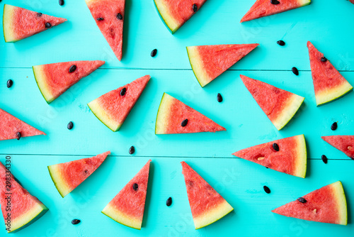 Watermelon slice on a blue rustic wood background