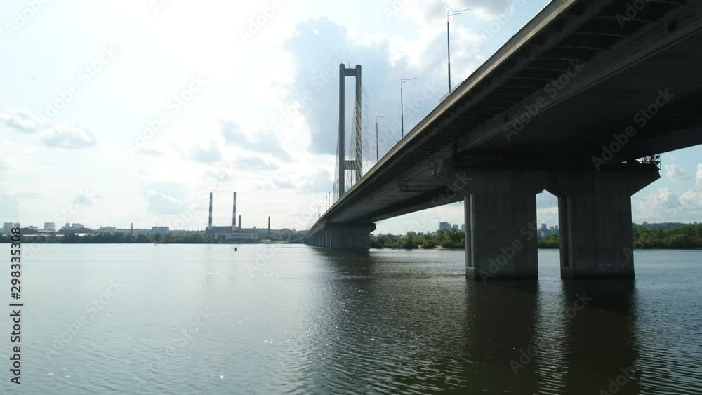 Aerial survey of the south bridge in Kiev through the Dnieper. Span over water and shooting of the bridge from below 4 Aerial survey of the south bridge in Kiev through the Dnieper. Span over water and shooting of the bridge from below 4