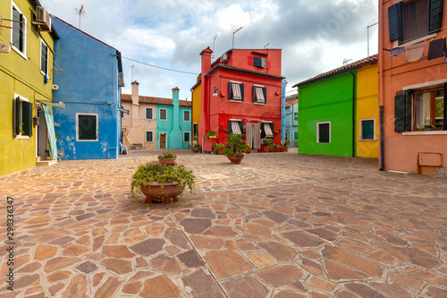 Facades of traditional old houses on the island of Burano. © pillerss