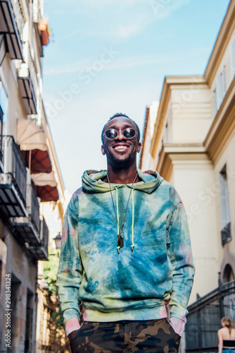 Portrait of happy young man in the city photo