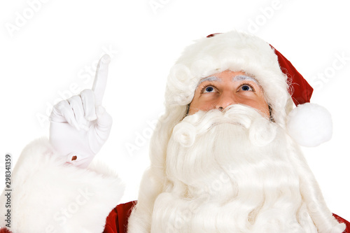 Christmas: Santa Looks And Point Upward On White
