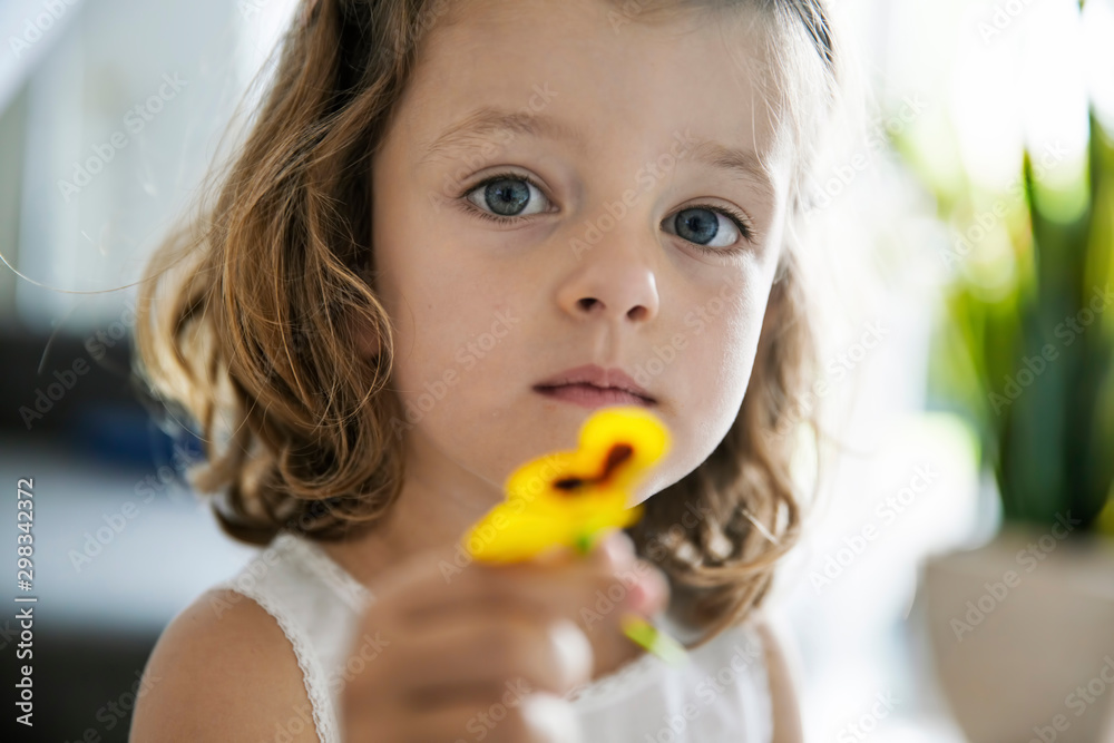 Close up of girl holding flower Close up of girl holding flower