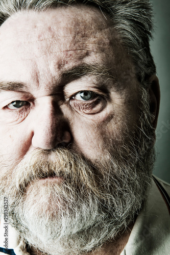 Portrait of senior man with full beard, close-up