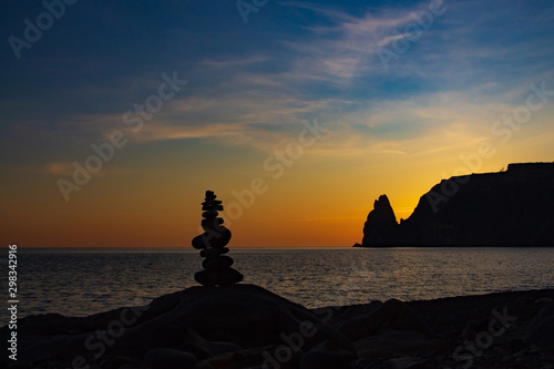 Zen concept. Sunset. The object of the stones on the beach at sunset. Relax & Meditation. 