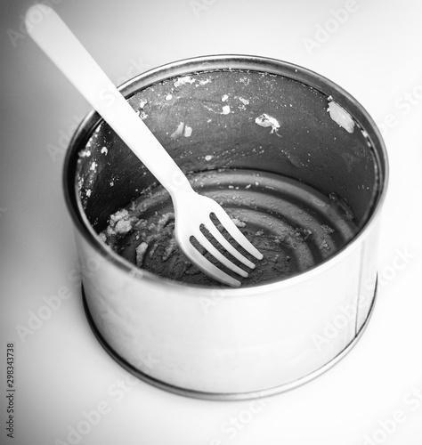 used tin can on white photo