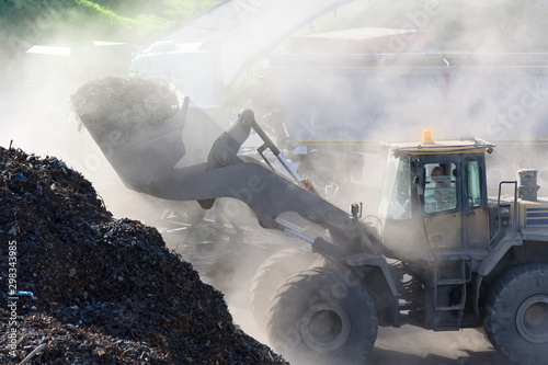 Germany, Baden-Wurttemberg, incinerator TREA Breisgau, wheel loader loading scrap photo