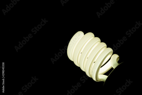 spiral fluorescent lamp isolated on black background