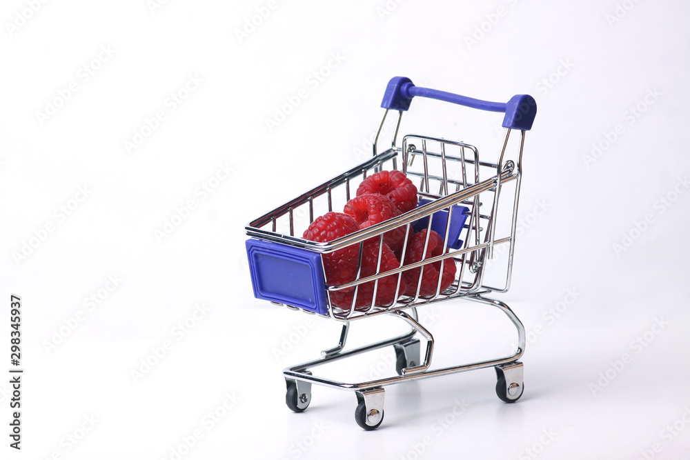 shopping cart with raspberry isolated on white background shopping cart with raspberry isolated on white background