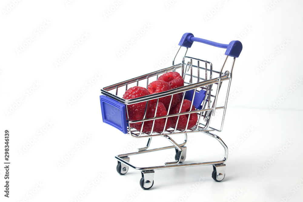 shopping cart with raspberry isolated on white background shopping cart with raspberry isolated on white background