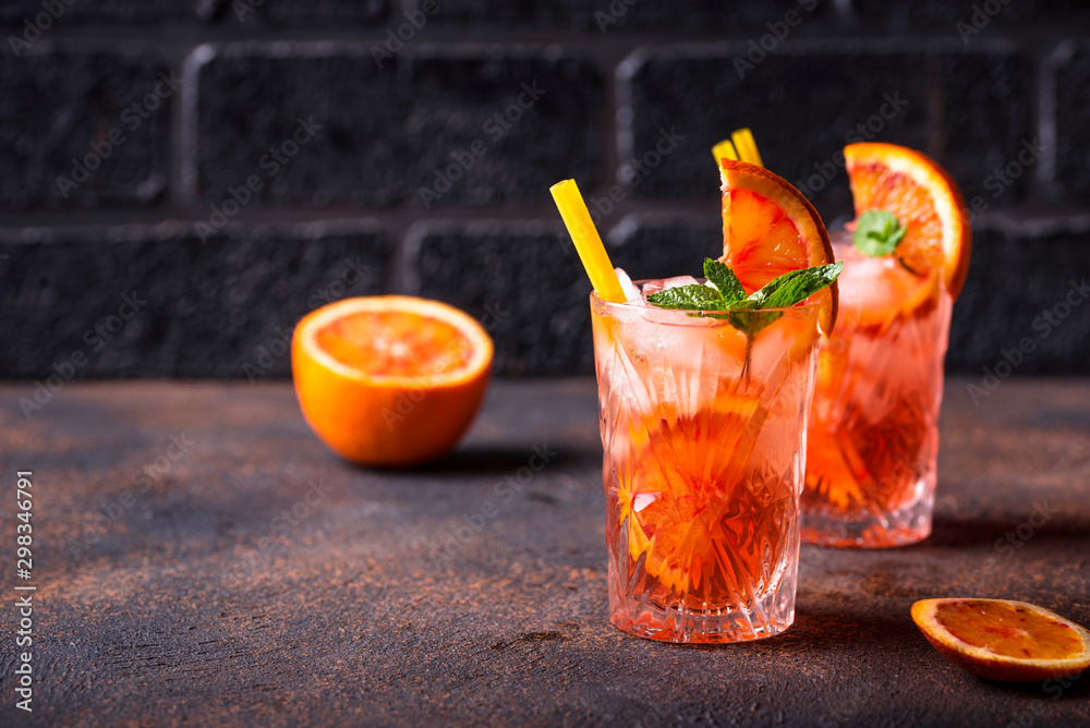 Negroni cocktail with orange and ice - obrazy, fototapety, plakaty 