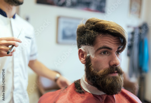 Customer with full beard in a barber shop