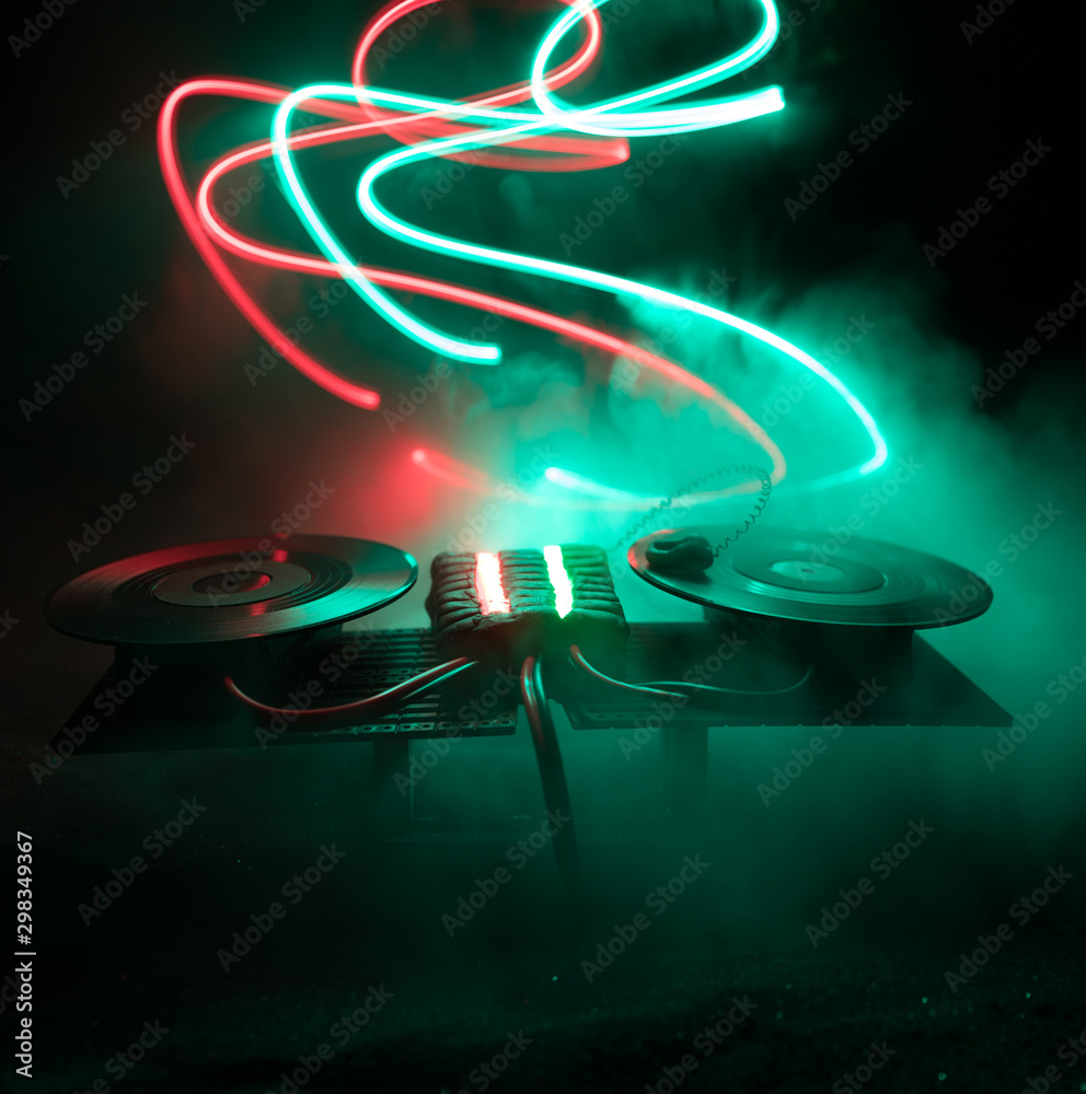 Dj club concept. Creative artwork decoration of dj table on dark toned
