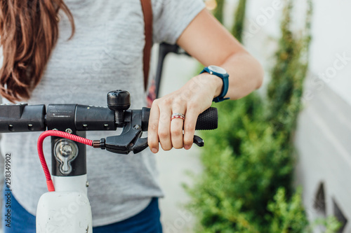 Woman Grips Scooter photo