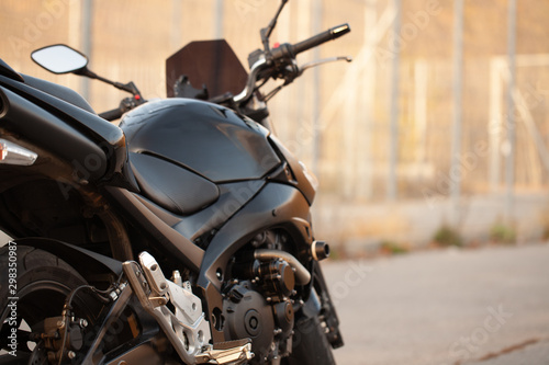 Stylish black sports bike on the street.