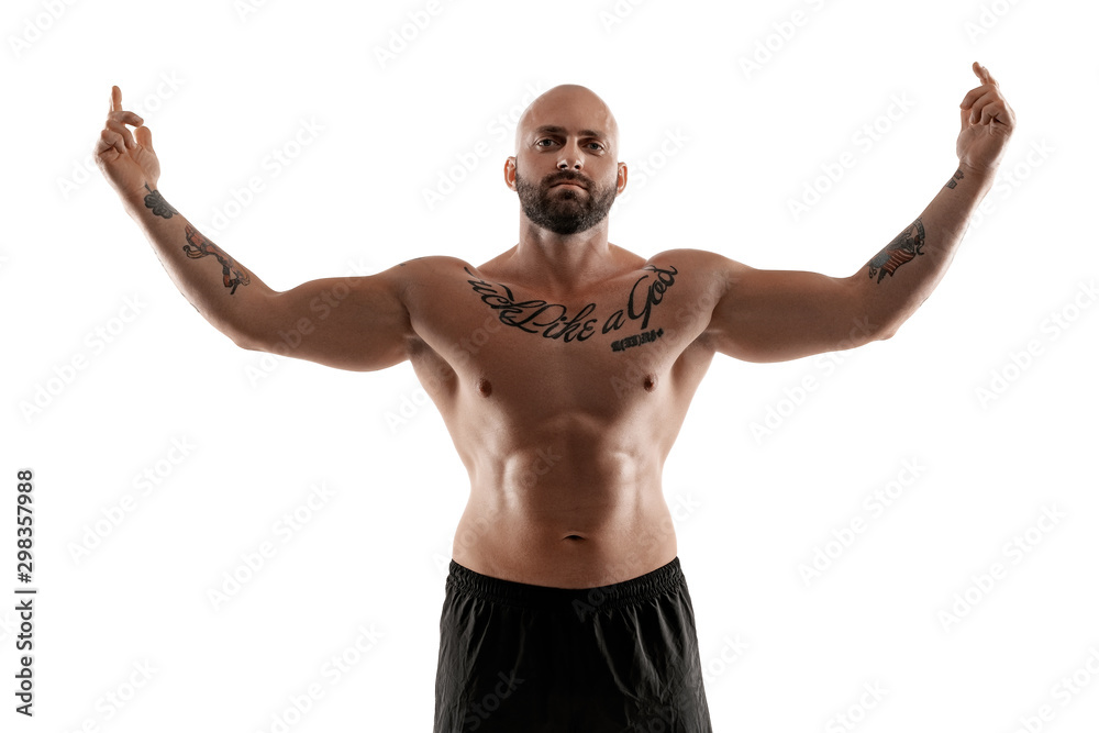 Fototapeta premium Athletic bald, tattooed man in black shorts is posing isolated on white background. Close-up portrait.