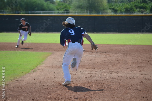 Baseball Player stealing second base