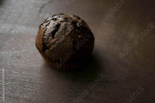 Chocolate cupcakes on brown background