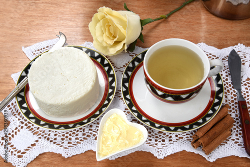 cup of tea with cheese on wooden table  brazilian breakfast