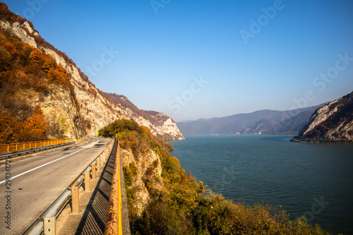 Sunrise on road in canyon at autumn. Road by the Danube river in Serbia.