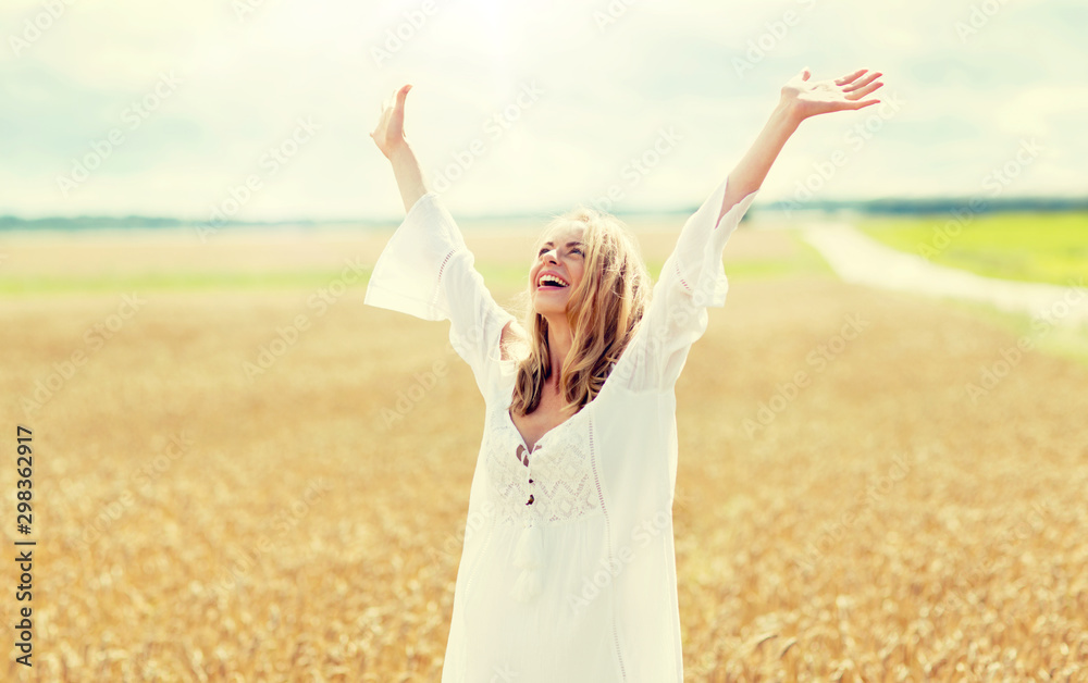 country, nature, summer holidays, vacation and people concept - smiling young woman in white dress on cereal field country, nature, summer holidays, vacation and people concept - smiling young woman in white dress on cereal field