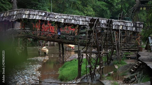 Famous Cat Cat Waterwheels in Northern Vietnam spinning in the river on a hot day in Autumn