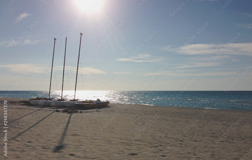 Boats parked on a sandy beach