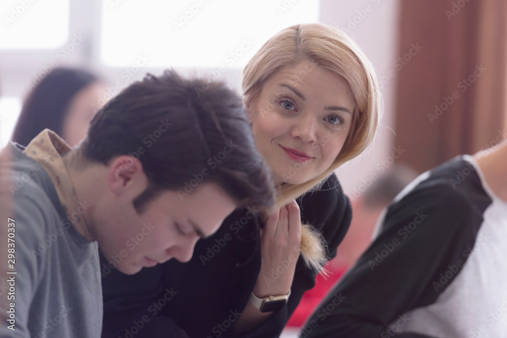 Female Architecture teacher at work. Female professor explain architectural projects to students. Beautiful female university architecture professor smiling into camera. Female Architecture teacher at work. Female professor explain architectural projects to students. Beautiful female university architecture professor smiling into camera.