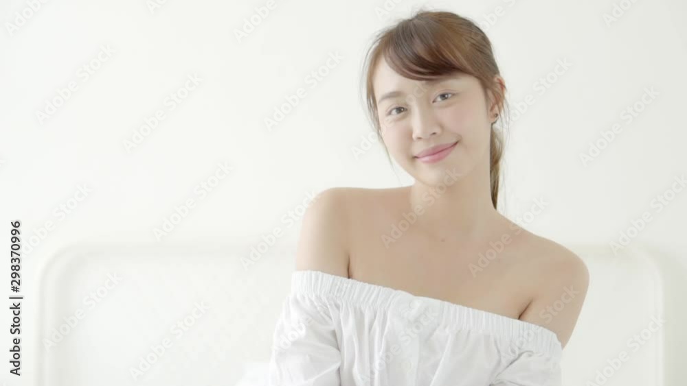Beautiful portrait young asian woman sitting and smile while wake up with sunrise at good morning, girl with happy and resting looking camera with happy, lifestyle and relax concept. Beautiful portrait young asian woman sitting and smile while wake up with sunrise at good morning, girl with happy and resting looking camera with happy, lifestyle and relax concept.