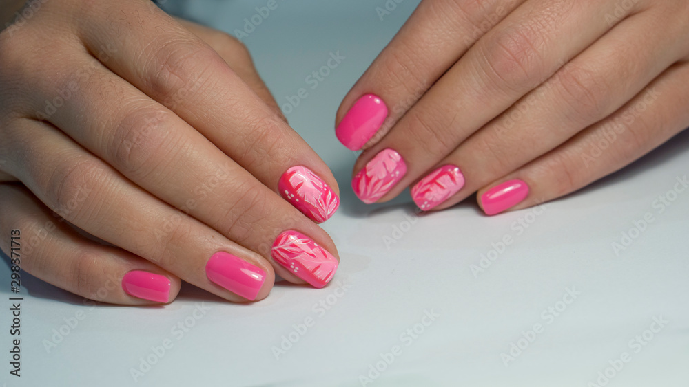 Nails Art Design. Hands With Manicure. Close Up Of Female Hands With Trendy Nails with decorations. Nails Art Design. Hands With Manicure. Close Up Of Female Hands With Trendy Nails with decorations.