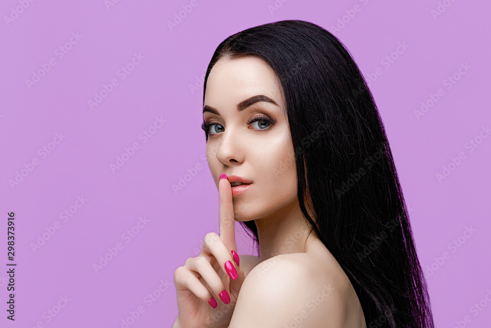 Portrait of model with natural nude make up with bare shoulders on purple background. Beautiful young woman with perfect glow clean skin. Portrait of model with natural nude make up with bare shoulders on purple background. Beautiful young woman with perfect glow clean skin.