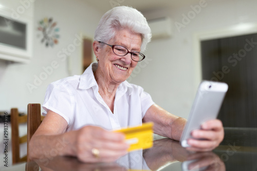 older woman at home with new technologies