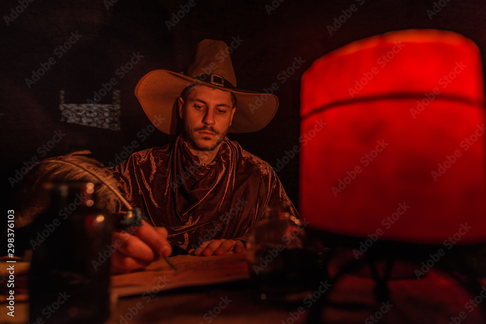 Nostradamus writing his prophesies, fantasy concept. illuminated by candles, long exposure, motion blur, high ISO Nostradamus writing his prophesies, fantasy concept. illuminated by candles, long exposure, motion blur, high ISO