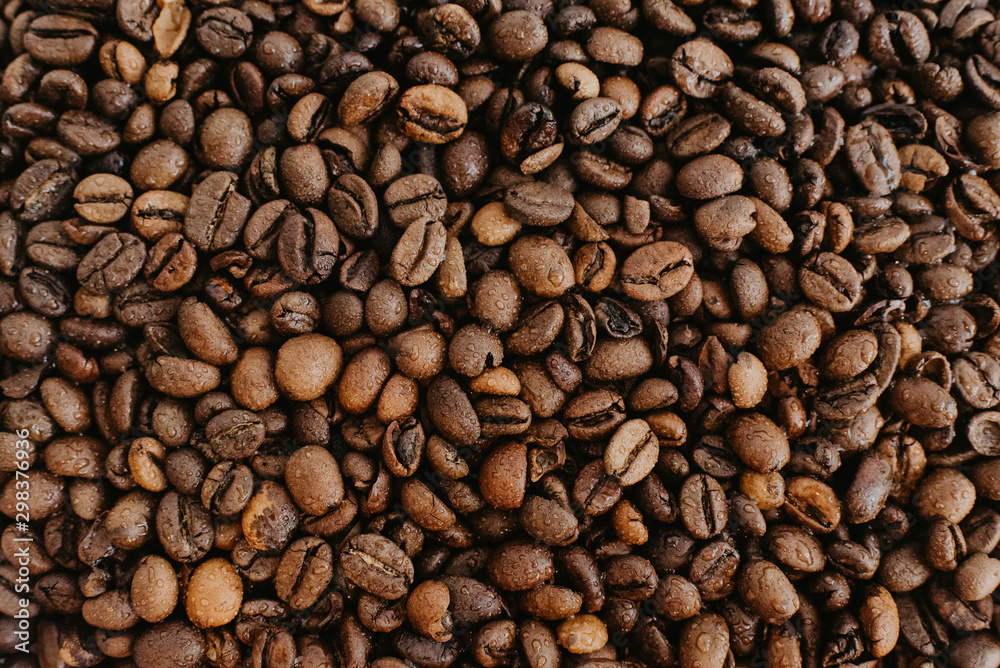 Wet coffee beans background Wet coffee beans background