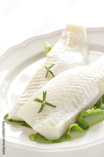 Freshness flat fish fillet on dish with rosemary