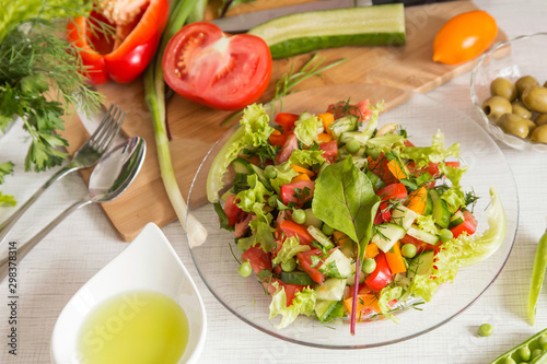 Fresh colorful vegetable salad in plate. Cooking healthy diet food	