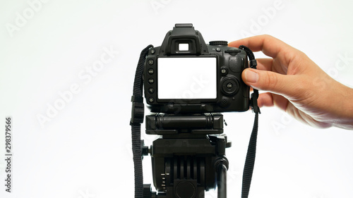 Hand taking pictures with a DSLR camera. mockup camera view