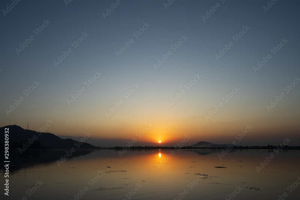 Majestic sunset view over Dal Lake in Kashmir, India. Since 1947 the ownership of Kashmir has been disputed between Pakistan and India.