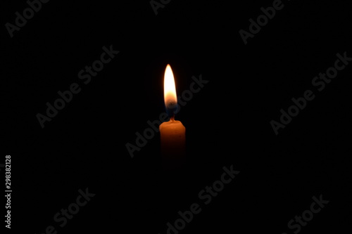 candlelight in the middle of the black screen