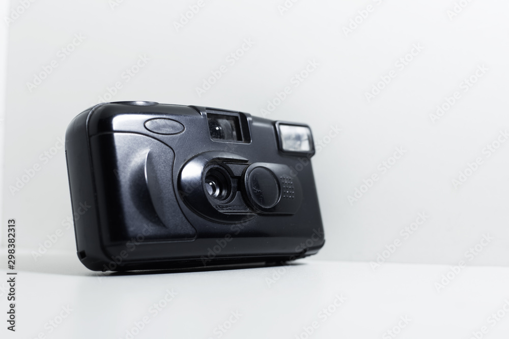 Close-up of old photo camera on white background.