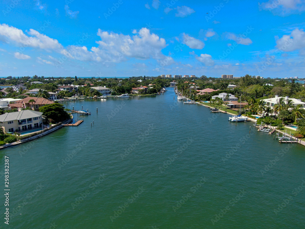 Aerial view of Bay Island neighborhood, luxury villas and boat, in Sarasota, Florida, USA