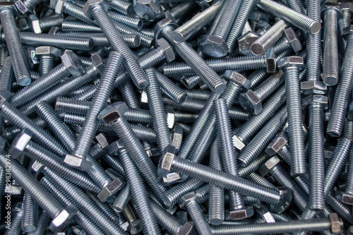 Large number of metal, steel bolts. Macro. Close-up. Background and texture.