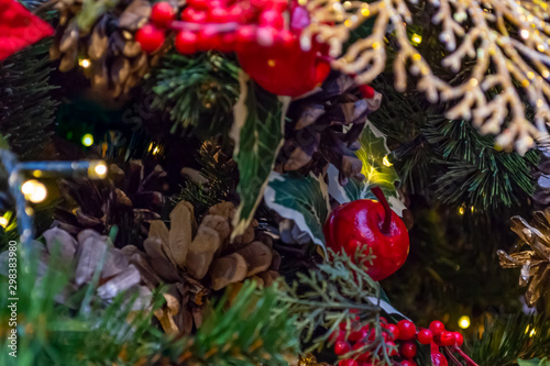Christmas decorations. Collage of Christmas toys, spruce branches, cones and berries. Close-up. © Sergiy