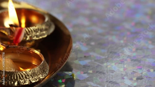 A close up of Oil lamps with flower petals,  for a Hindu festival Diwali, selective focus.